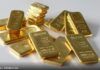 Gold dips in Asia on mild profit-taking, politics offer support